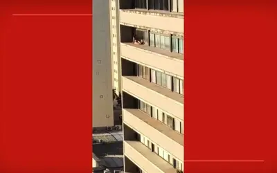 VÍDEO: Mulher se arrisca e toma sol em marquise de prédio no DF